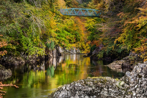 Autumn in the magnificent wooded river gorge at Killiecrankie where one of the goriest battles in Jacobite history took place in July 1689, Cairngorms National Park, Scotland, United Kingdom