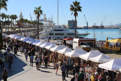 Outdoor market stalls in the port of Malaga on a beautiful Sunny day, Andalusia, Spain