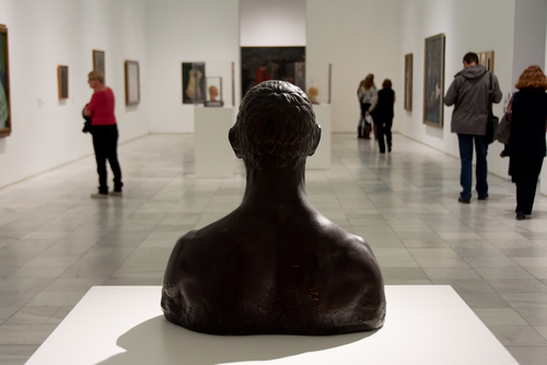 Interior view of Reina Sofia museum with people, dedicated to modern and contemporary art, Madrid, Spain