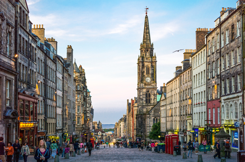 The Royal Mile looking towards Holyrood,with the Tron Kirk bell tower in the background, Edinburgh, Scotland, UK