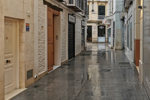 View of the streets of Soho in Málaga on a rainy day, Andalusia, Spain