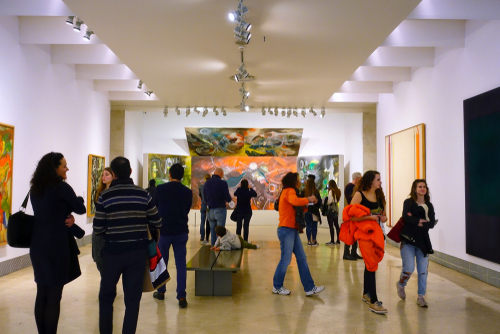 Visitors looking at the pictures in the museum Thyssen-Bornemisza in Madrid, Spain