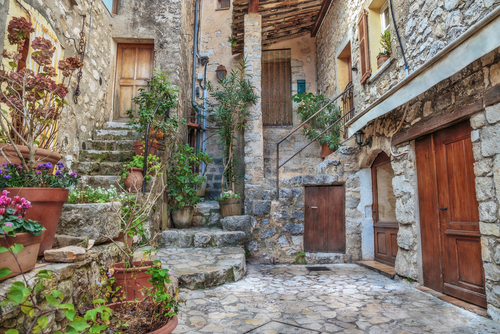 Beautiful patio with flowers in the old village of Gourdon in the French Riviera, Cote d'Azur, France