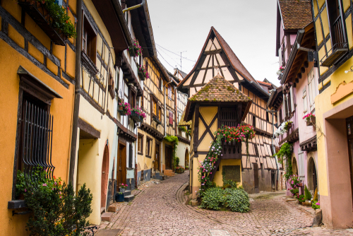 Street view of colored half-timbered houses in the village of Eguishem, Alsace, France