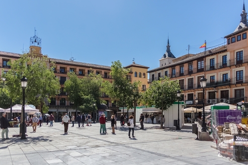 View of the Zocodover Plaza with people visiting a street market, Toledo, Castile-La Mancha, Spain