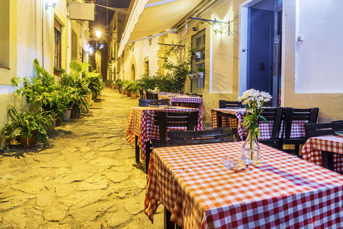 Street cafes in the old town of Tossa de Mar, Costa Brava, Catalonia, Spain