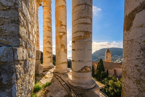 View from inside the columns at the top of the ancient Roman Trophy of Augustus monument of the Mediterranean Sea and church of La Turbie, in the historic town of La Turbie in the French Riviera, Cote d'Azur, France