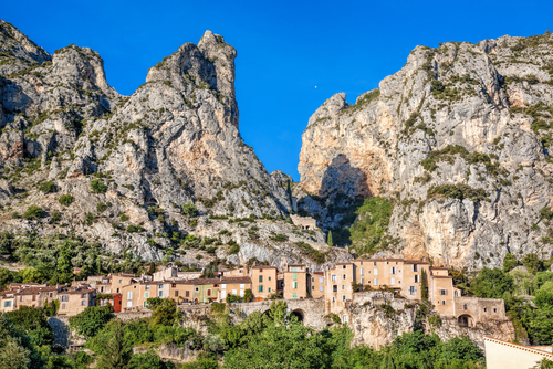 Moustiers Sainte Marie village with rocks in Provence, France