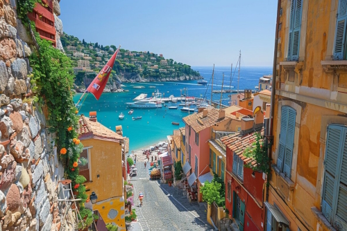 View of a small alley overlooking the sea in the village of Villefranche-sur-mer, the French Riviera, Cote d'Azur, France