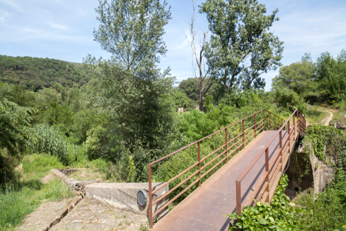 Beautiful landscape and metal bridge in Garrotxa region, Catalonia, Spain