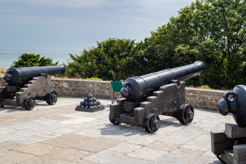 Cannons at a terrace of the castle overlooking the sea. Walmer castle was built in 1539–40 as one of a chain of coastal artillery forts located near Dover, Kent, UK