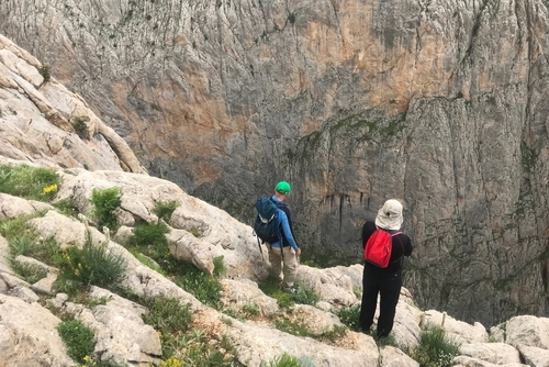 Mountaineers watch Cimbar Valley in Aladaglar National Park in Nigde, Cappadocia, Turkey