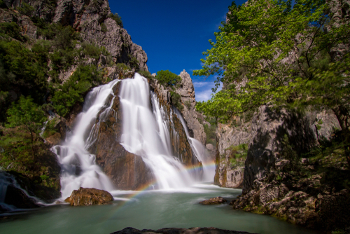Ucansu waterfall between the mountain, the great waterfall and lake flowing in the canyon, Antalya, Turkey