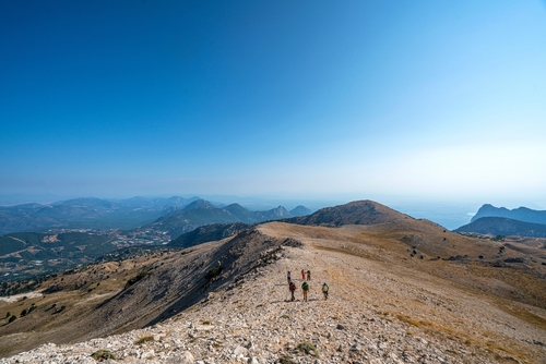 People hiking with the scenic view of Feslikan Plateau and Alaben Mountain, Antalya, Turkey