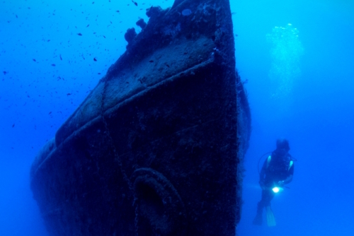 Diver exploring Paris II shipwreck near Kemer, Antalya, Turkey
