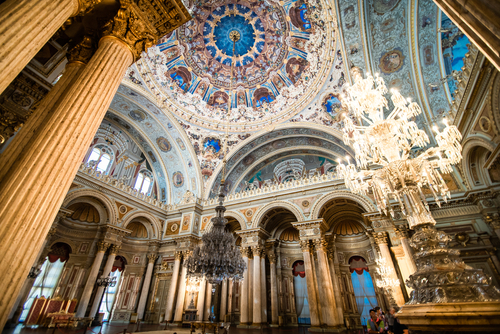 Chandeliers and colorful cieling of Dolmabahce Palace in Istanbul, Turkey