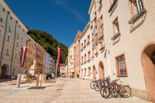 Schoendorferplatz square with Town hall and World wars memorial in the old town of Hallein, Austria