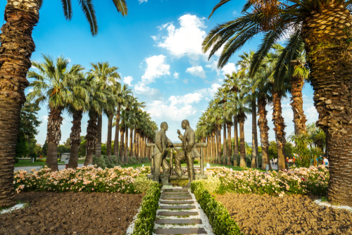 Two black men statue standing and talking to each other in public park called kültürpark in Izmir, Turkey