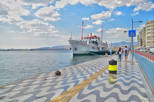 People at Kordon side of Pasaport Pier the most popular destination in Izmir, Turkey. The famous place seaside in the city