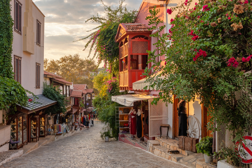 Beautiful street in the Kas old town with boutique shops at Sunset, Antalya, Turkey