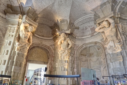 The sala terrena, the giant hall, contains eight supporting atlases by court sculptor L. Mattielli and the museum shop of Klosterneuburg Abbey, Klosterneuburg, Austria