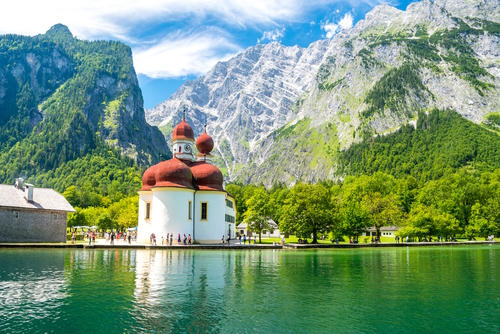 Konigsee lake with St. Bartholomew church surrounded by mountains, Berchtesgaden National Park, Bavaria, Germany