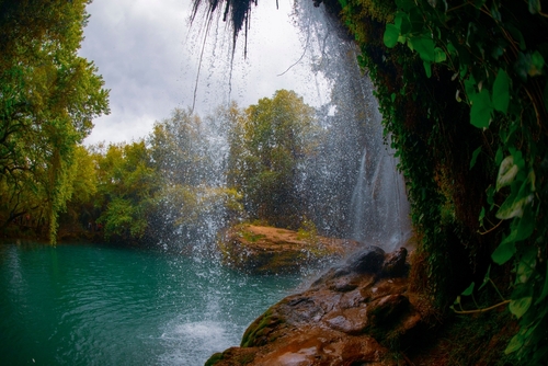 Beautiful waterfalls over emerald water in deep green forest in Kursunlu Natural Park, Antalya, Turkey