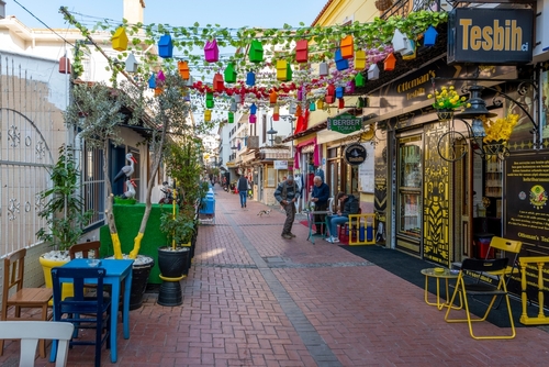 A colorful row of shops and cafes in the shopping a marketplace district of the Turkish port town of Kusadasi, Izmir, Turkey