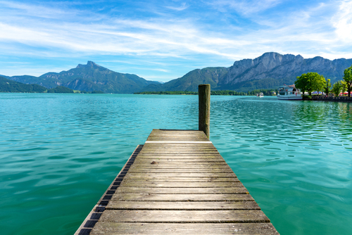 Mondsee with mountains vier from a wooden rustic dock pier, Salzkammergut, Austria