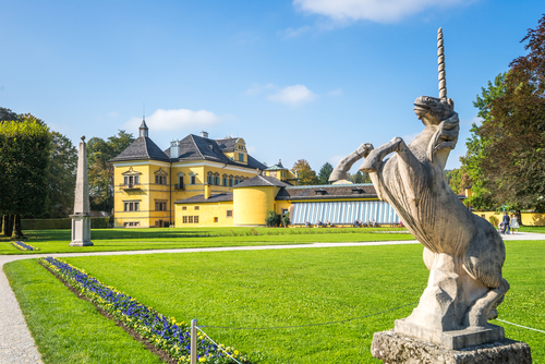 A unicorn statue and luscious gardens at the Hellbrunn Palace in Salzburg, Austria