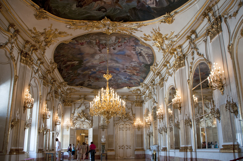 Interior view of the beautiful ceiling and decorations at Schonbrunn Palace, a former imperial summer residence in Vienna, Austria