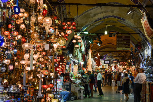 People walking in the Grand Bazaar, Mosaic Ottoman lamps in Istanbul, Turkey
