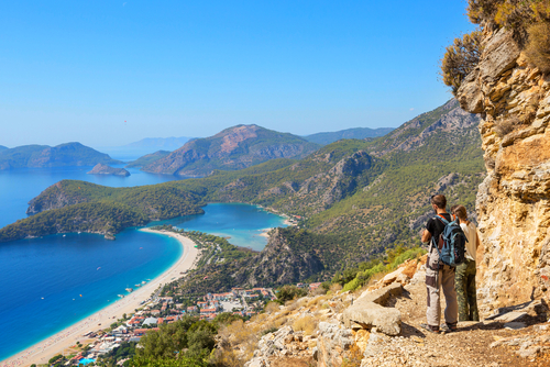 Two hikers hiking through the beautiful nature landscapes and mountains, The Lycian way, Antalya province, Turkey