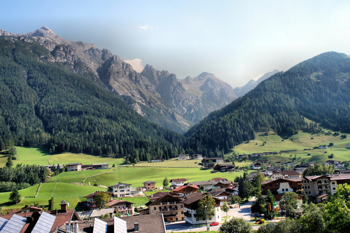 Austrian landscape of mountains and forests, view of a village in the Stubai Valley in Tyrol, Austria