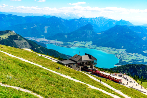 Amazing view from Schafberg by St. Sankt Wolfgang im in Salzkammergut on lake Wolfgangsee, alps mountains, Sparber, Dachstein mountain, blue sky, train Schafbergbahn, Austria