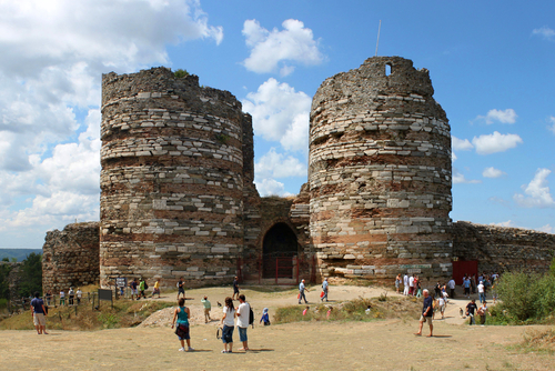 Tourists in front of the gate of Yoros Kalesi in Anadolu Kavagi village at the Bosphorus near Istanbul, Turkey