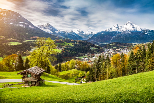 Panoramic view of beautiful mountain landscape in the Bavarian Alps with village of Berchtesgaden and Watzmann massif in the background at Sunrise, Nationalpark Berchtesgadener Land, Bavaria, Germany