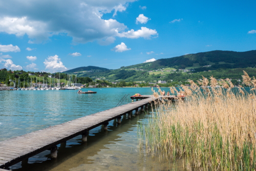 View of the Mondsee lake with wooden footbridge, Salzkammergut region, Austria