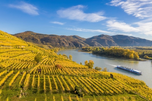 Autumn panorama of Wachau valley (Unesco world heritage site) with ship on Danube river near the Weissenkirchen village near Vienna in Lower Austria, Austria