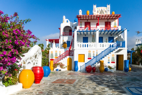 A fully colored and decorated typical house with bougainvillea in Ano Mera village on the Island of Mykonos, Cyclades Islands, Greece