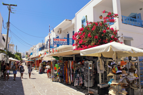 View of people walking the main street of Antiparos town, Antiparos Island near Paros Island, Cyclades Islands, Greece