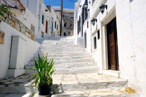 View of the typical cycladic, whitewashed alleys at Apeiranthos village on the island of Naxos, Cyclades Islands, Greece