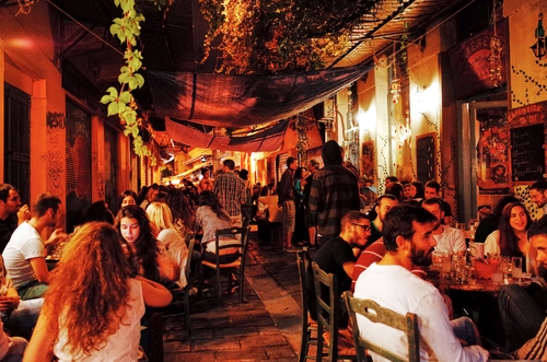 People enjoying a nice dinner at a restaurant at the Monastiraki district, Athens, Greece