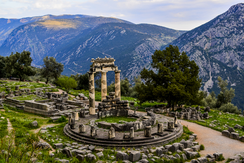 View of the Sanctuary of Athena and the mountains in the backrgound in Delphi, near Athens, Greece