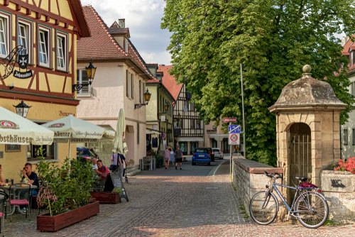 Beautiful street in Bad Mergentheim, a typical village of the Romantic Route where there is a restaurant with its terrace to rest, Bavaria, Germany