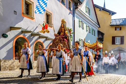 Participants in traditional bavarian clothes at the Corpus Christi procession in Berchtesgaden, Bavaria, Germany