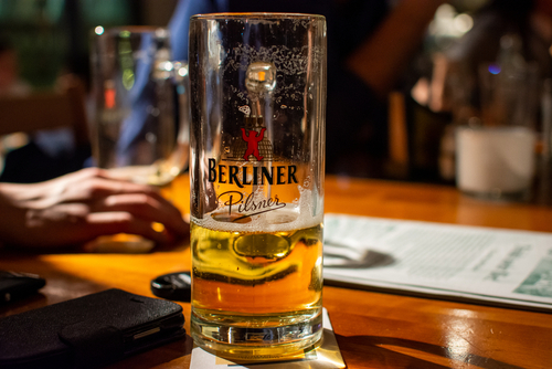Glass of Berliner Pilsner beer served in a bar in Berlin, Germany