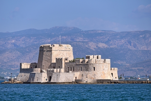 View of the Venetian water fortress, Bourtzi, at the entrance of the harbour in Nafplio city, the Peloponnese, Greece