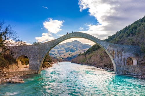 The great arched stone bridge of Plaka on Arachthos river, Tzoumerka, Epirus, Greece