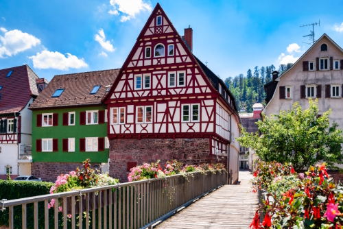 Beautiful colorful view of flowers and half-timbered houses city landscape in Calw in the Black Forest, Baden-Württemberg, Germany